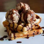 Waffles with ice-cream and chocolate peanut sauce